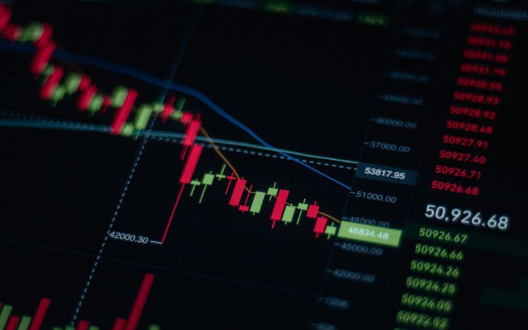 A business data graph displayed on a dark monitor