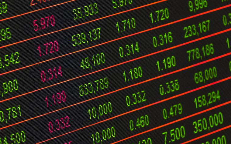 A digital board of live market data figures