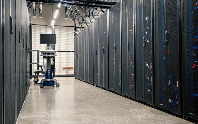 A data center corridor lined with server racks