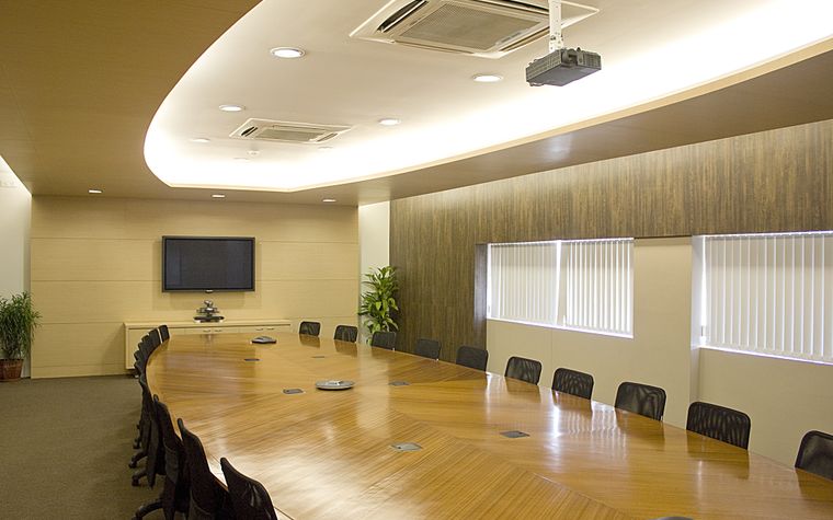 A corporate boardroom set for a meeting
